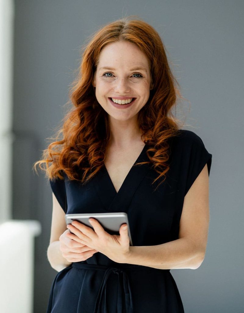 portrait-of-content-redheaded-businesswoman-with-d-EYLN464.jpg